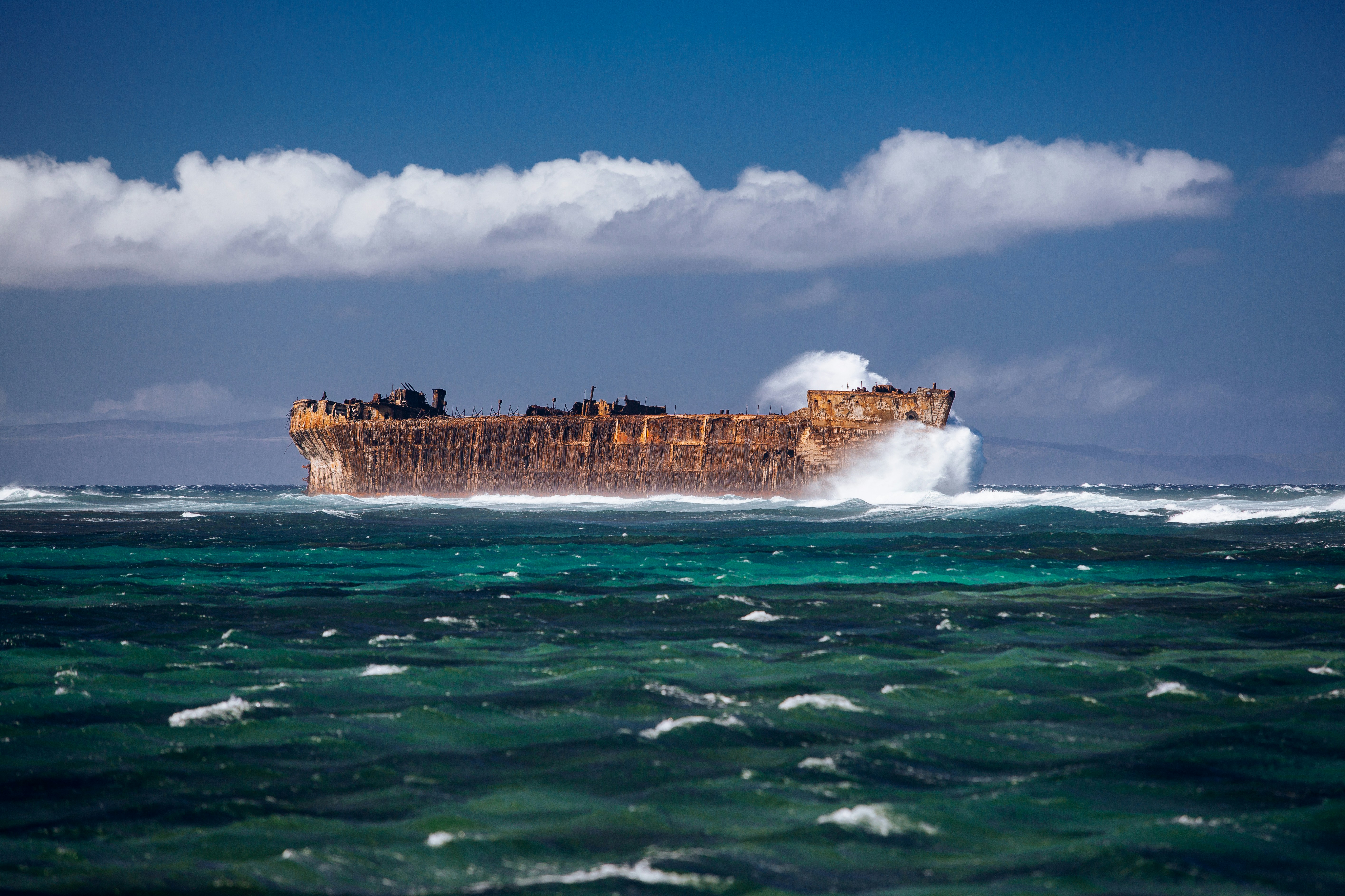 body of water during daytime, Rusty ship