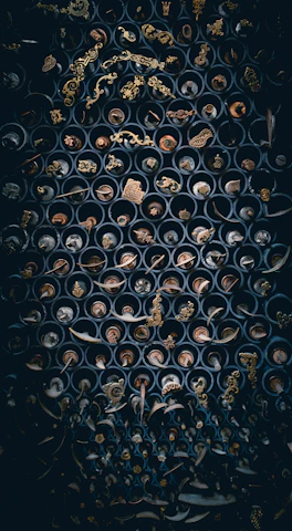 Finished metal pieces arranged neatly, showcasing different textures and finishes.