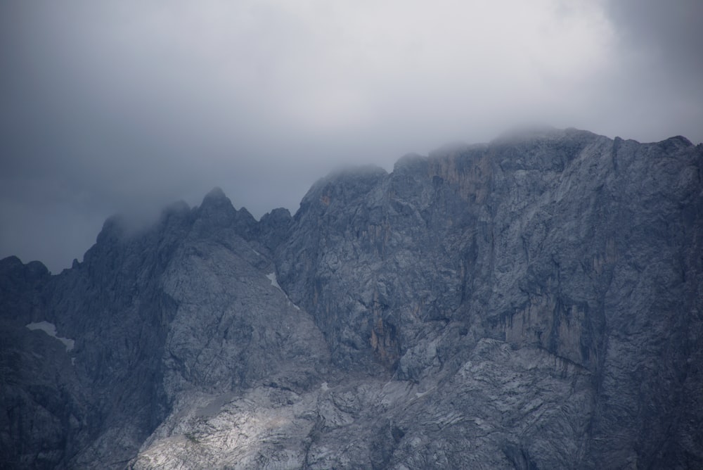 landscape photography of mountains covered my clouds during daytime