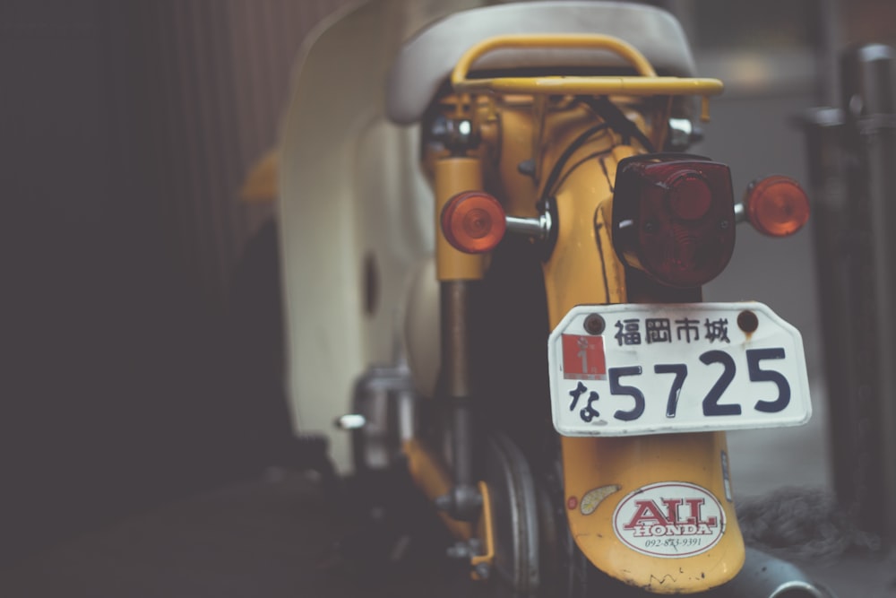 macro shot photography of white motorcycle