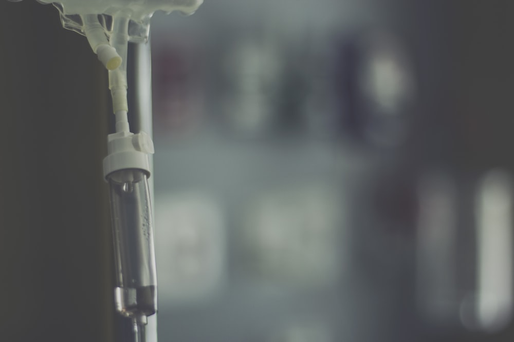 a close up of a toothbrush with a blurry background