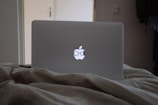 Close-up of a vinyl decal being applied to a laptop.
