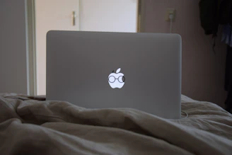 Detailed shot of custom vinyl decals being applied to a laptop surface.