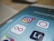 A close-up of a smartphone screen displaying a folder labeled 'Photography' with several app icons. The Instagram app icon is prominently shown with a notification badge, indicating a new message or activity. Other visible apps include Hyperlapse, Boomerang, and Lightroom.