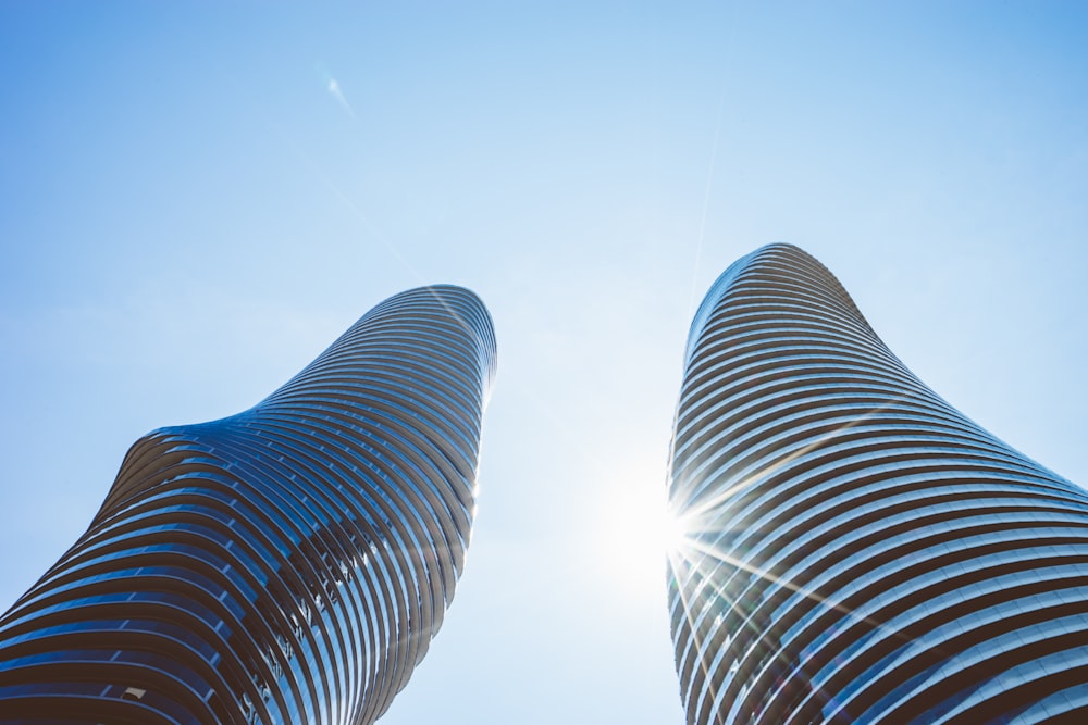 low angle photo of glass buildings