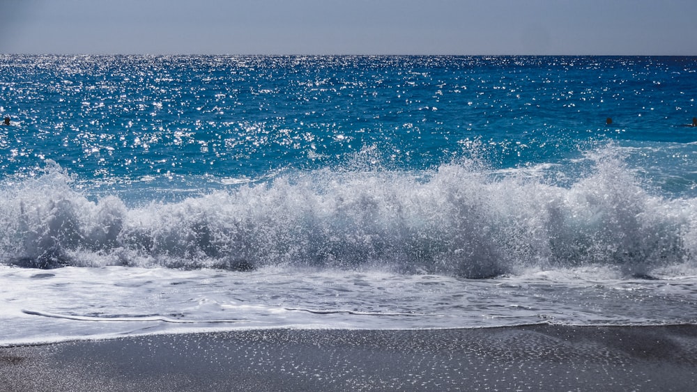 ocean waves on beach shore during daytime