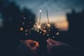 person holding fire cracker shallow focus photography