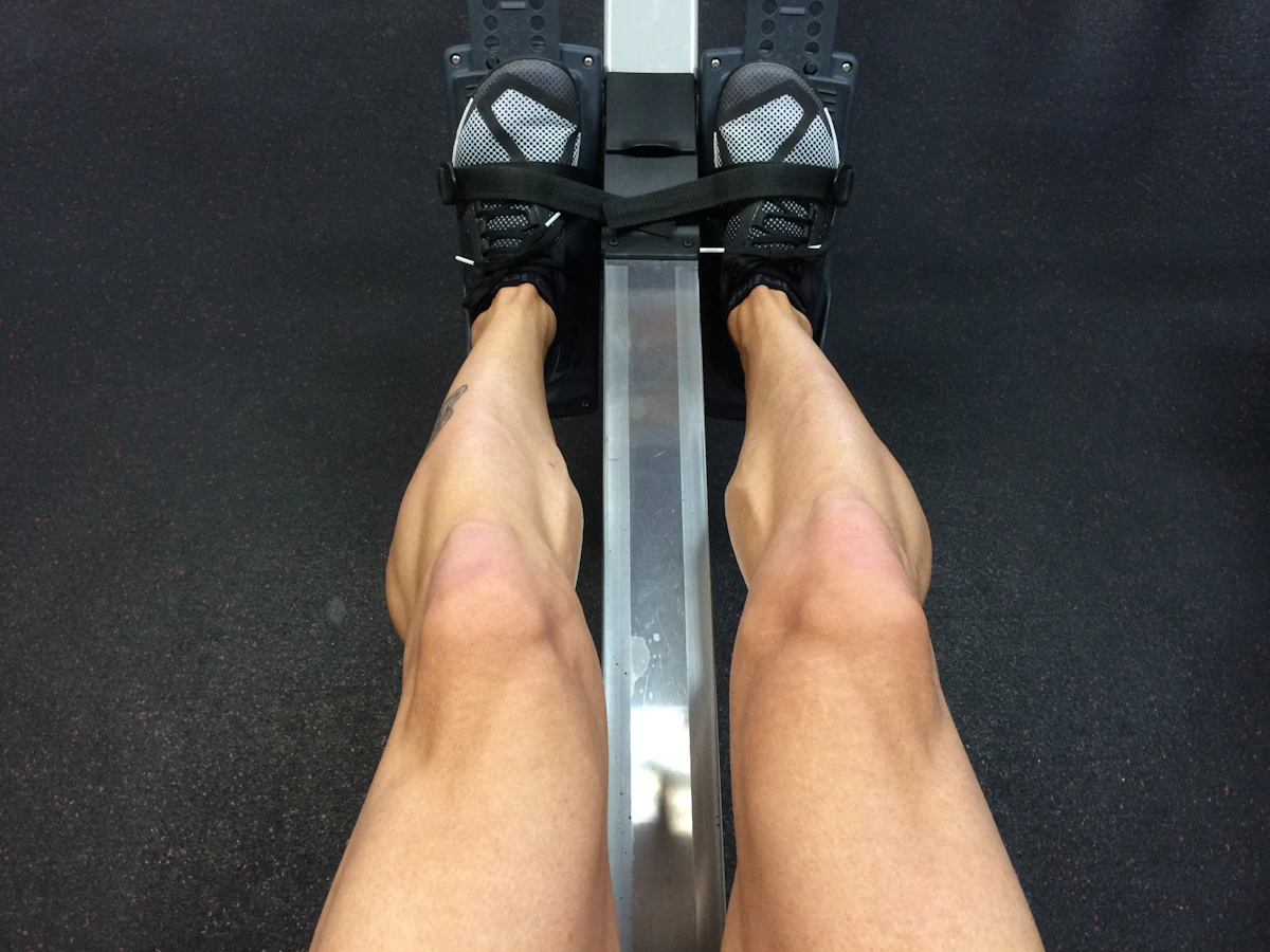 An athlete using an indoor rowing machine