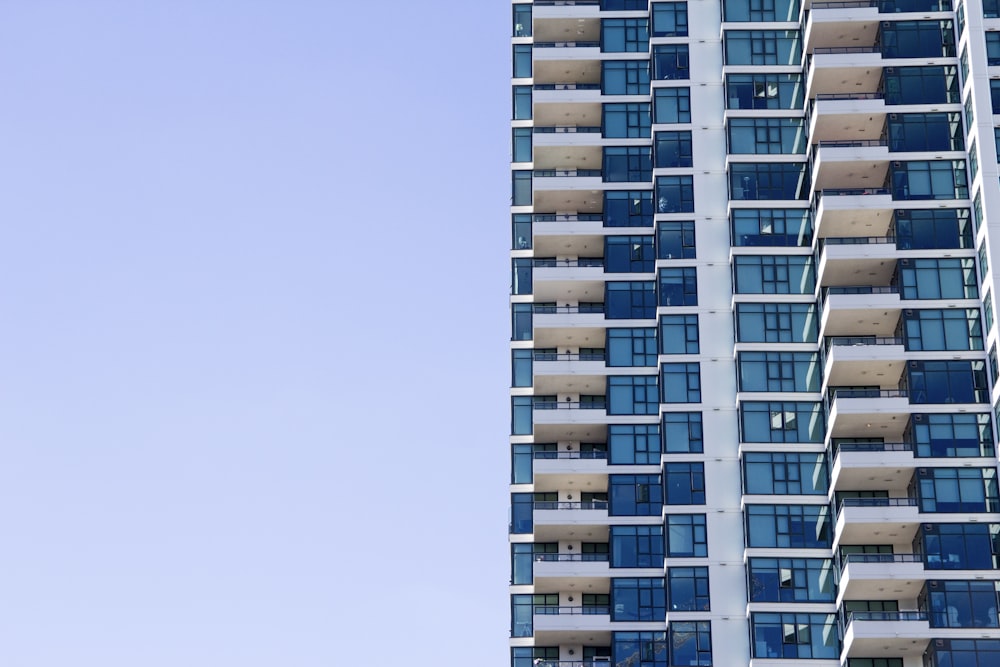 blue and grey high-rise glass building