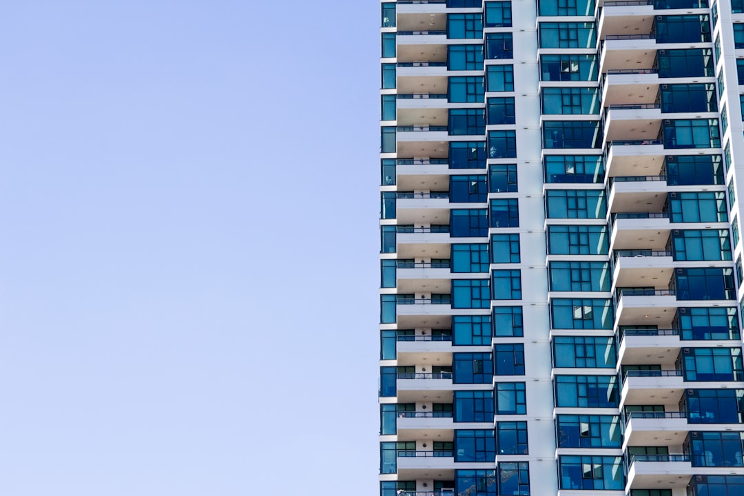 blue and grey high-rise glass building