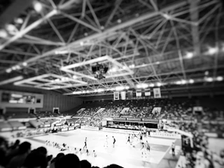 A vibrant photo capturing a historic basketball game in Williams Lake with players and fans immersed in the moment.