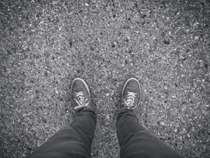Close-up of a runner's feet hitting the asphalt in the city, without brand logos.