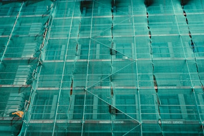 scaffolding covered by green net