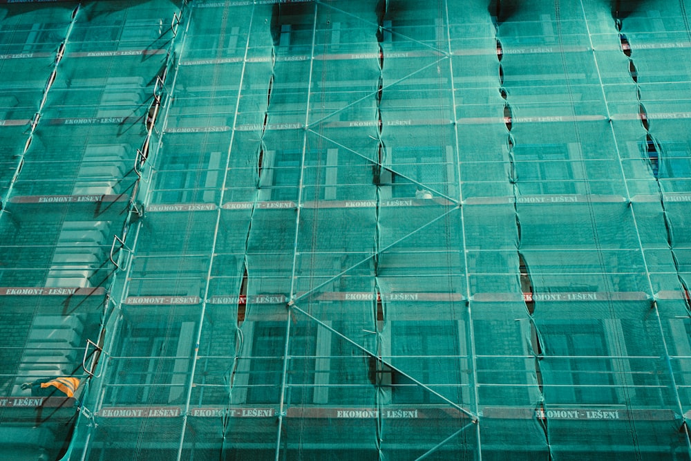 scaffolding covered by green net