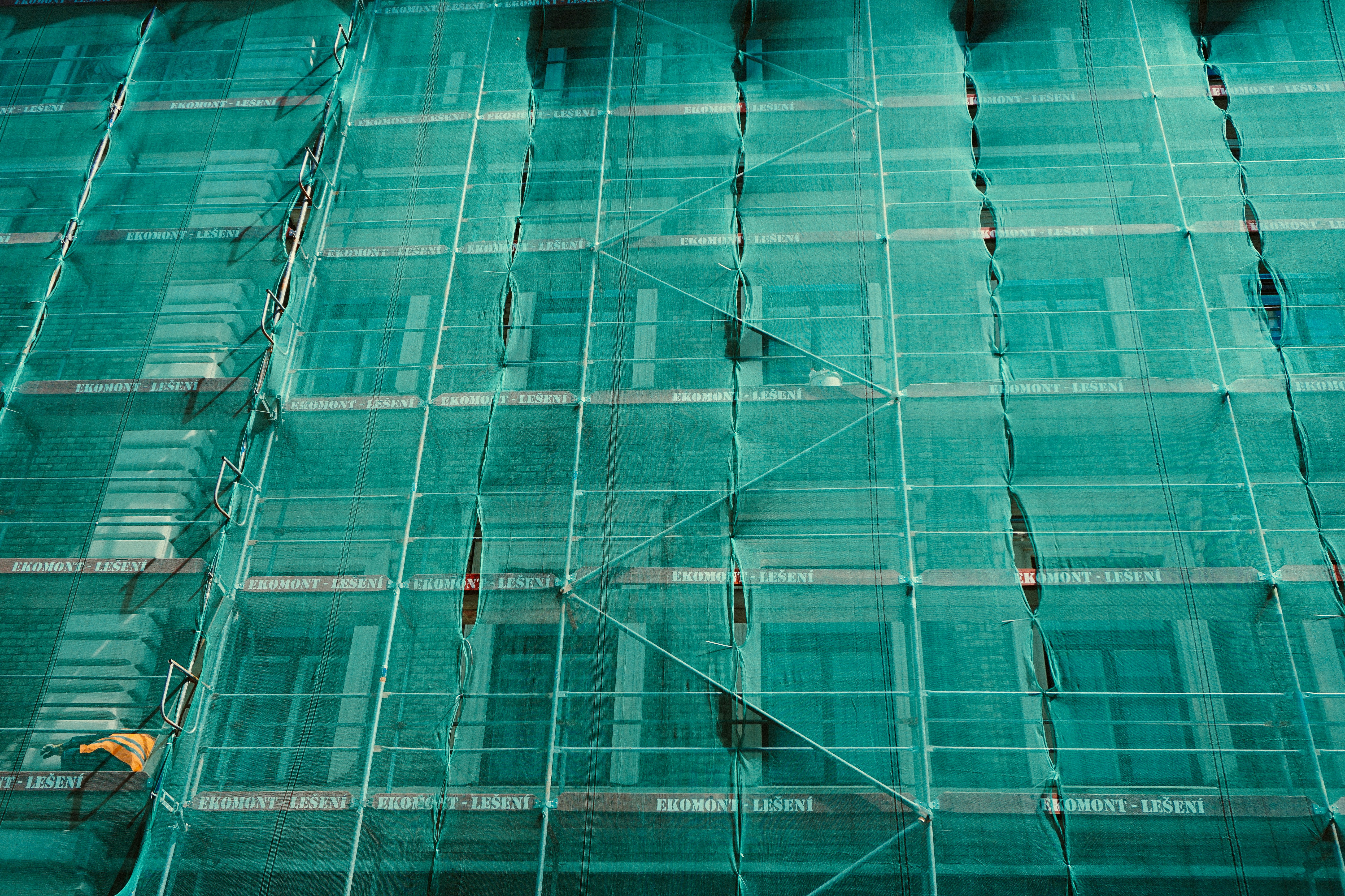 Green mesh scaffold on a building