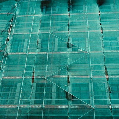 scaffolding covered by green net