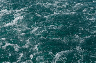 Traditional churning scene with soft green and white background emphasizing natural purity.