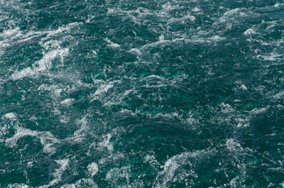 Traditional churning scene with soft green and white background emphasizing natural purity.