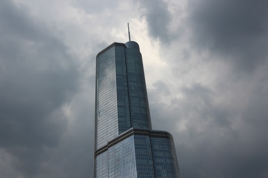 low angle photography of gray high-rise building under cloudy sky in Chicago Riverwalk United States