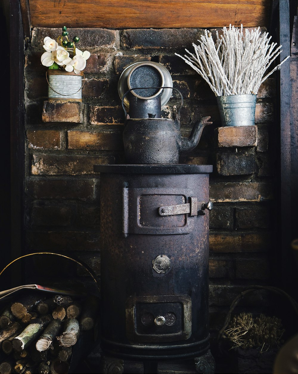 cast-iron teapot on wood burner