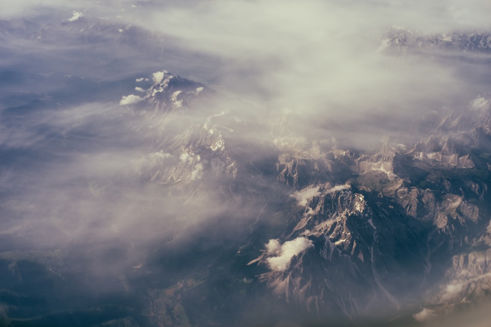 top view of mountain under white clouds