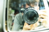 A close-up of a camera capturing a creative photoshoot.