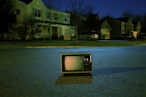 turned off vintage CRT television on road