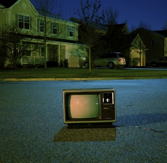 turned off vintage CRT television on road