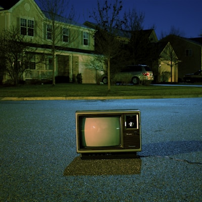 turned off vintage CRT television on road