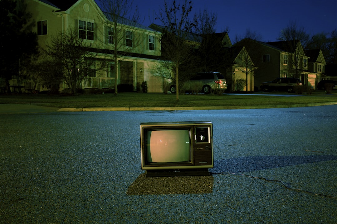 turned off vintage CRT television on road, Retro TV on suburban road