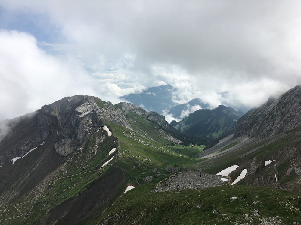 gray and green mountain under white sky during daytime photography