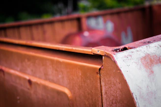 Close-up of a weathered container corner with rust details and locking mechanisms.
