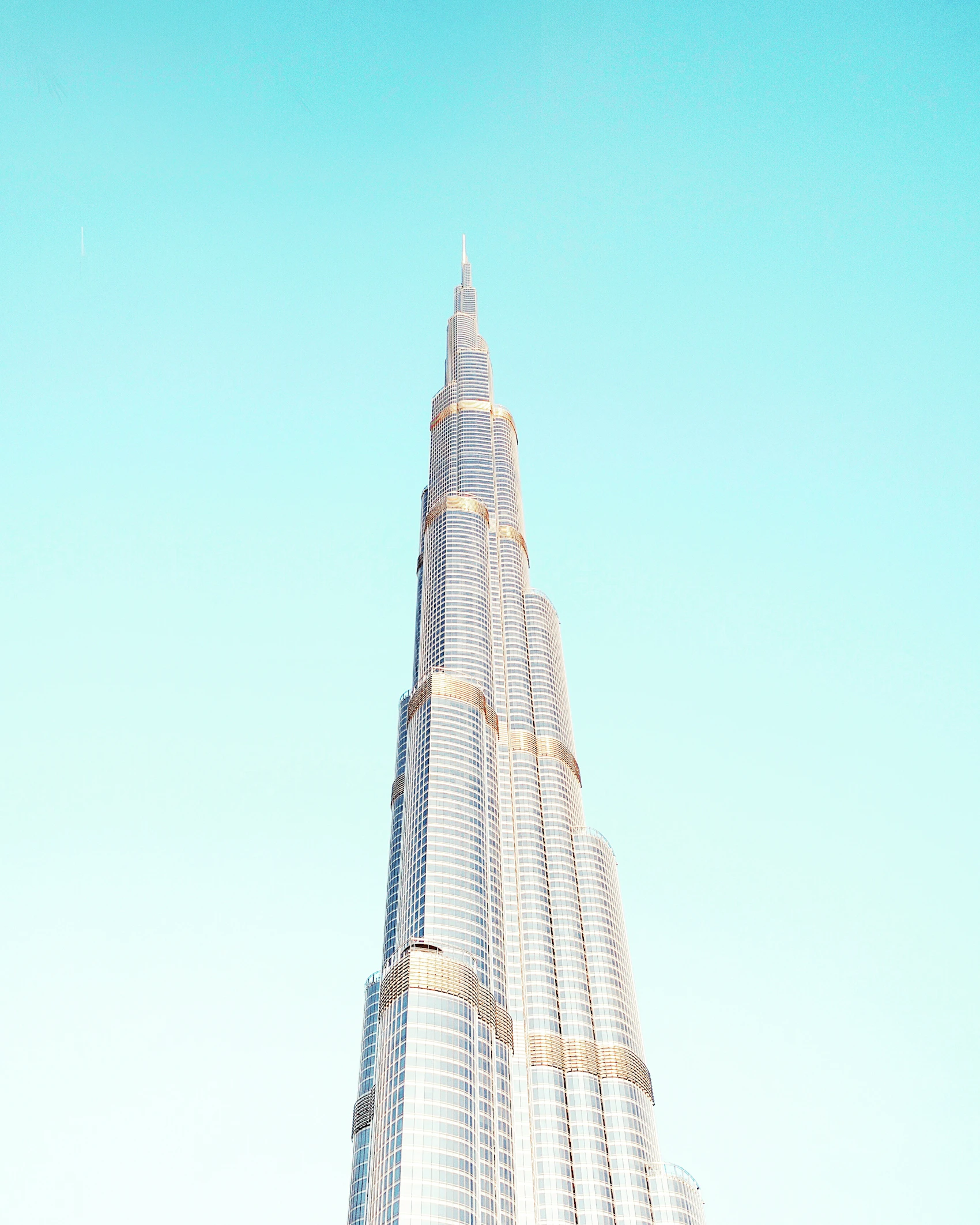 The Burj Khalifa viewed closely against a clear blue Dubai sky
