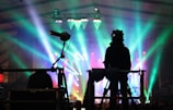 silhouette of man standing on stage