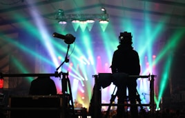 silhouette of man standing on stage