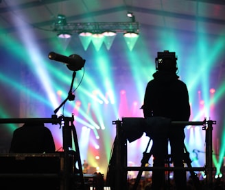 silhouette of man standing on stage