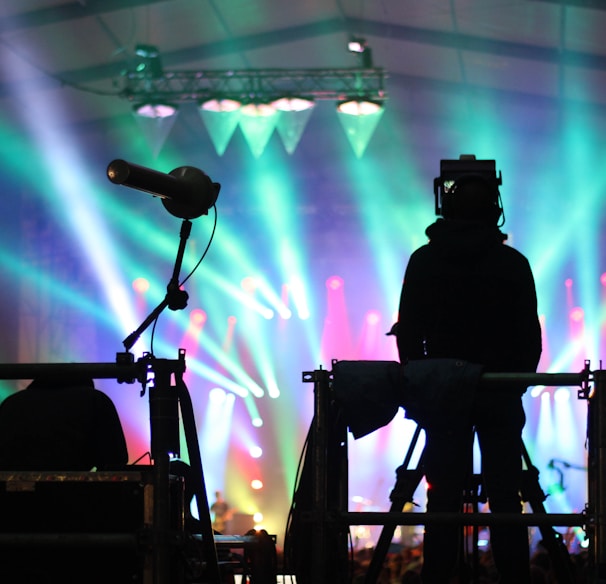 silhouette of man standing on stage