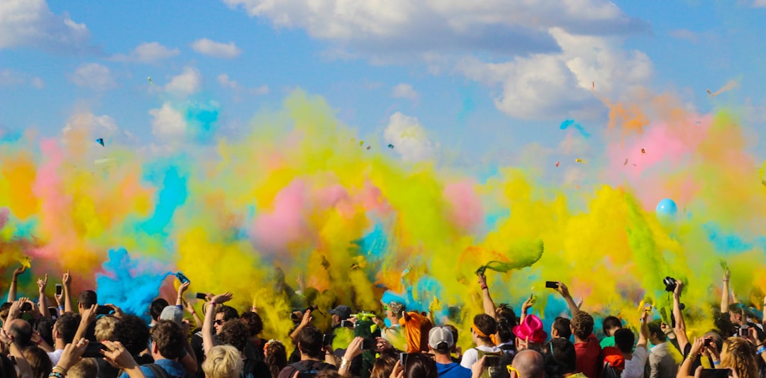 group of people celebrating powder festival outdoors,