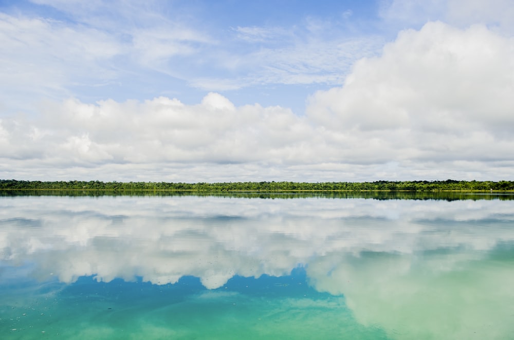 reflection of clouds in body of water