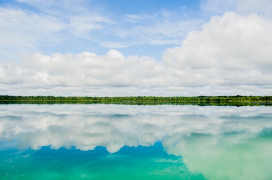 reflection of clouds in body of water in Lachuá Lake Guatemala