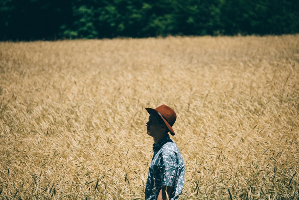 man standing at wheat field