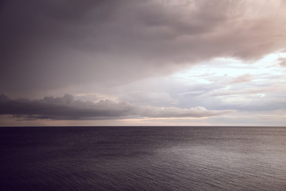 boy of water under comulus clouds