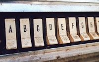 close up photography of brown jukebox letter keys