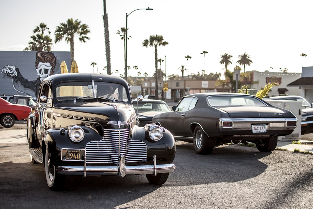 black car beside car during daytime