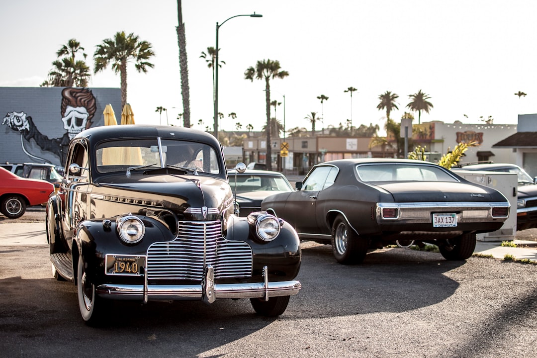 black car beside car during daytime