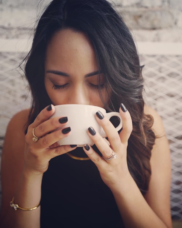 woman drinking with cup