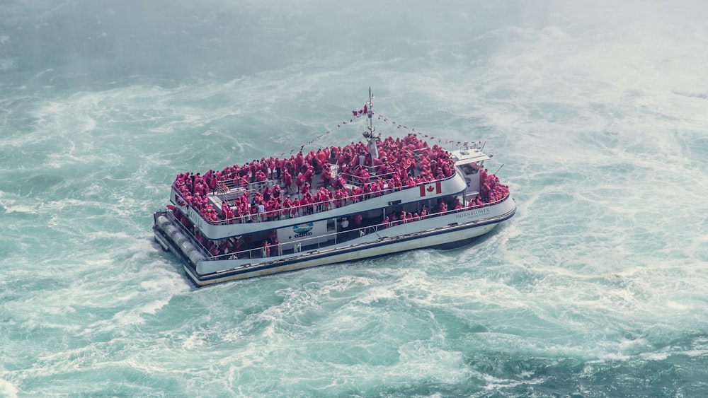 white boat with passengers