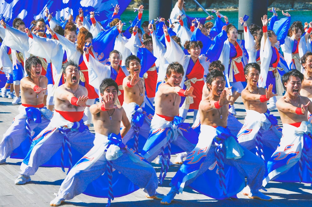 group of men dancing on street