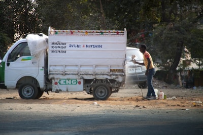 A fleet of NCN mini trucks lined up at dawn, ready for early morning deliveries across India.