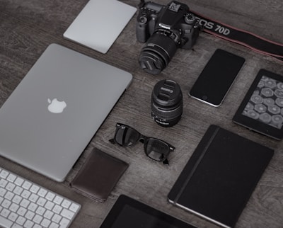 A collection of stylish gadgets and tech accessories neatly arranged on a desk.